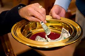 A bowl being passed around for Sunday church offerings.
