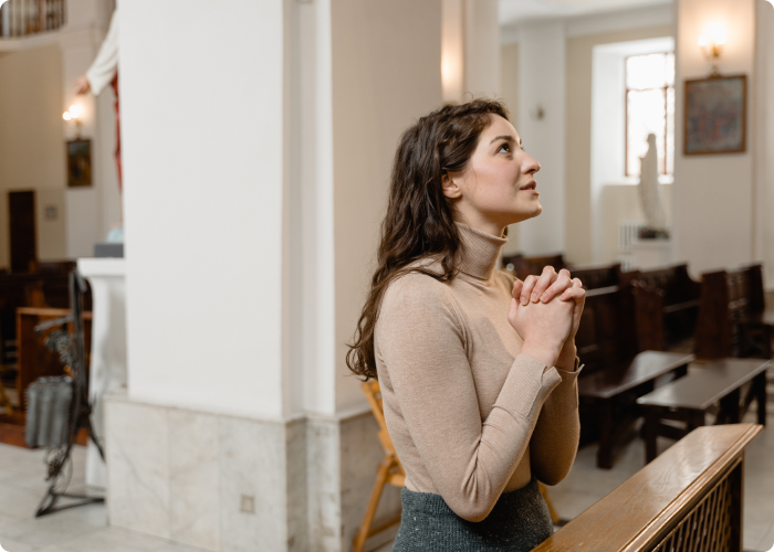 A woman praying in a church